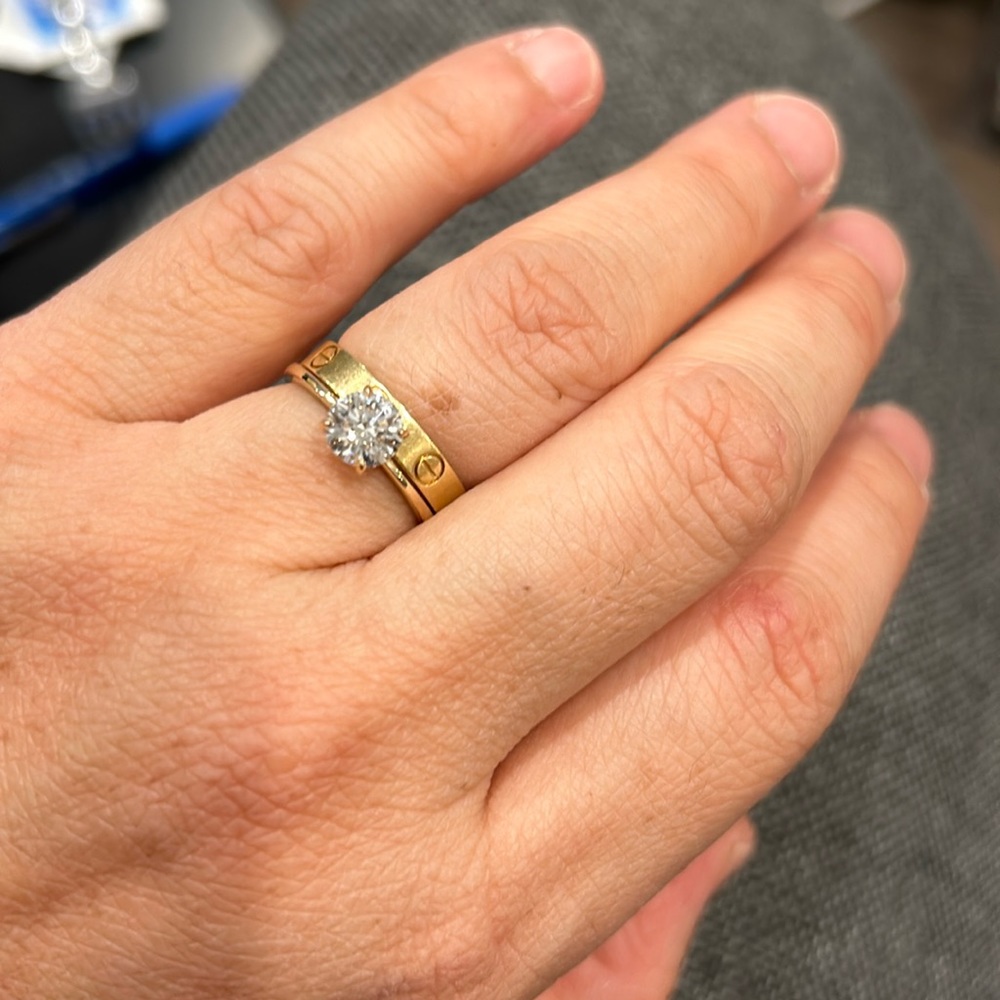 1.00 carat F, VVS2 14k yellow band size 7